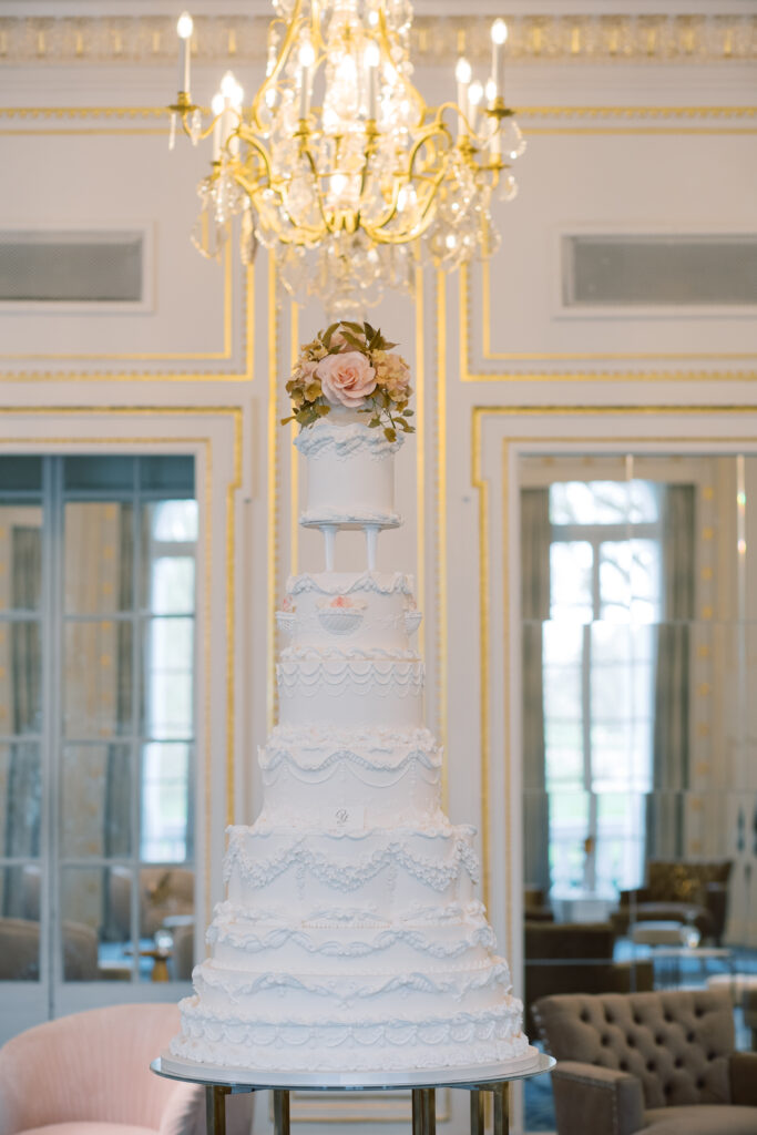 Statement luxury ivory wedding cake By Yevnig in the ballroom of the Mandarin Oriental, Hyde Park