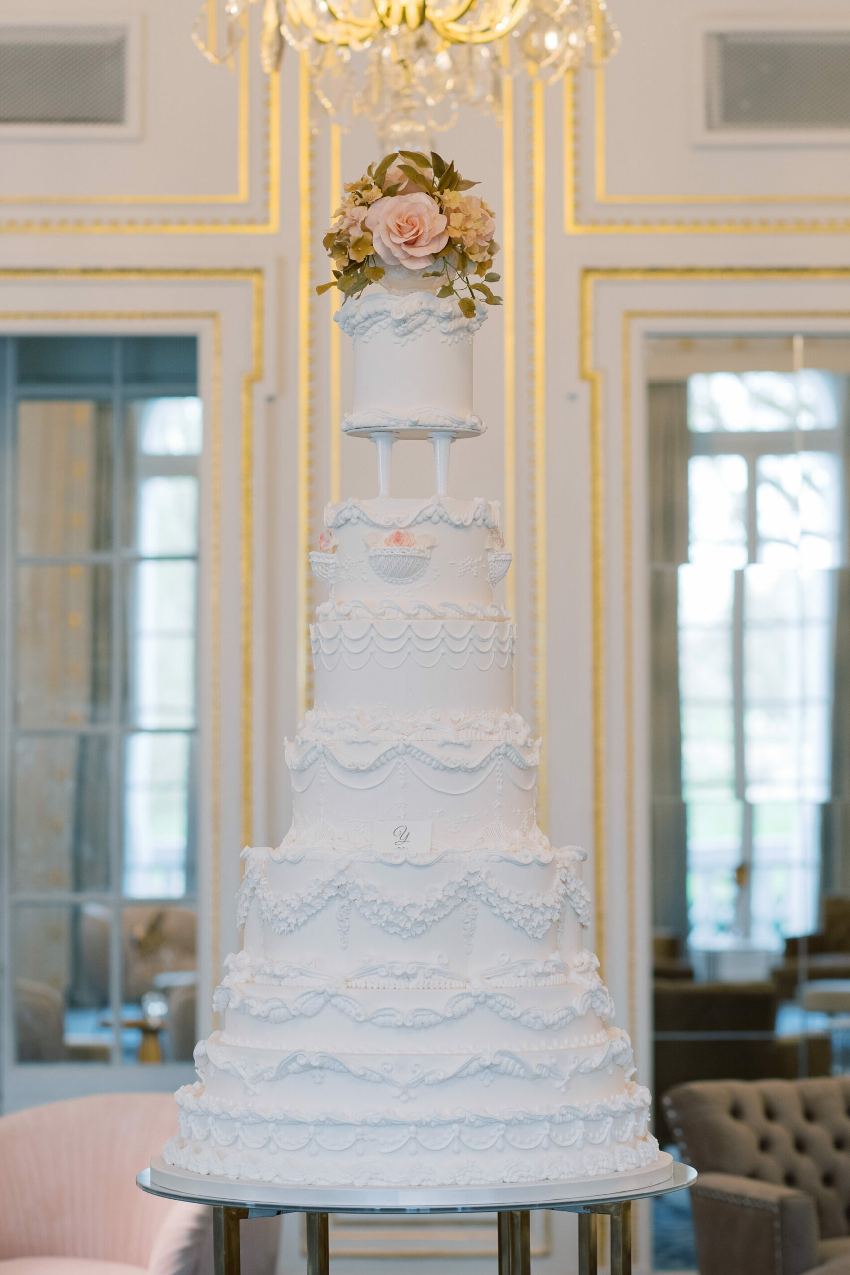 Statement luxury ivory wedding cake By Yevnig in the ballroom of the Mandarin Oriental, Hyde Park