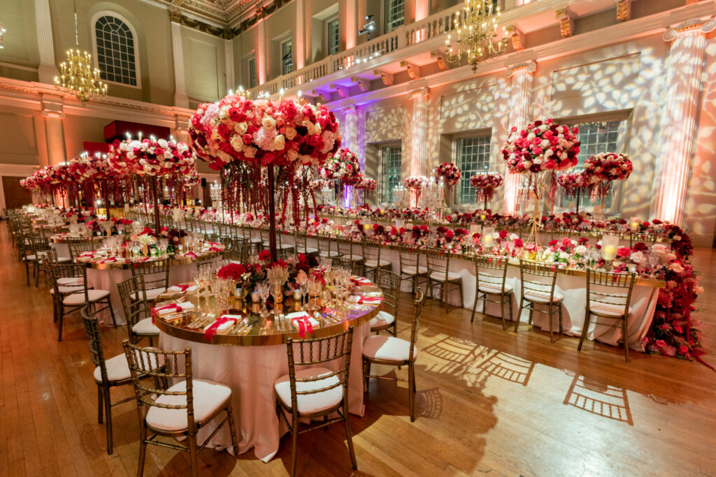 One of the Historic Royal Palaces, Banqueting House, Whitehall, London is set up ready for a wedding with mirrored table tops and beautiful floral displays.