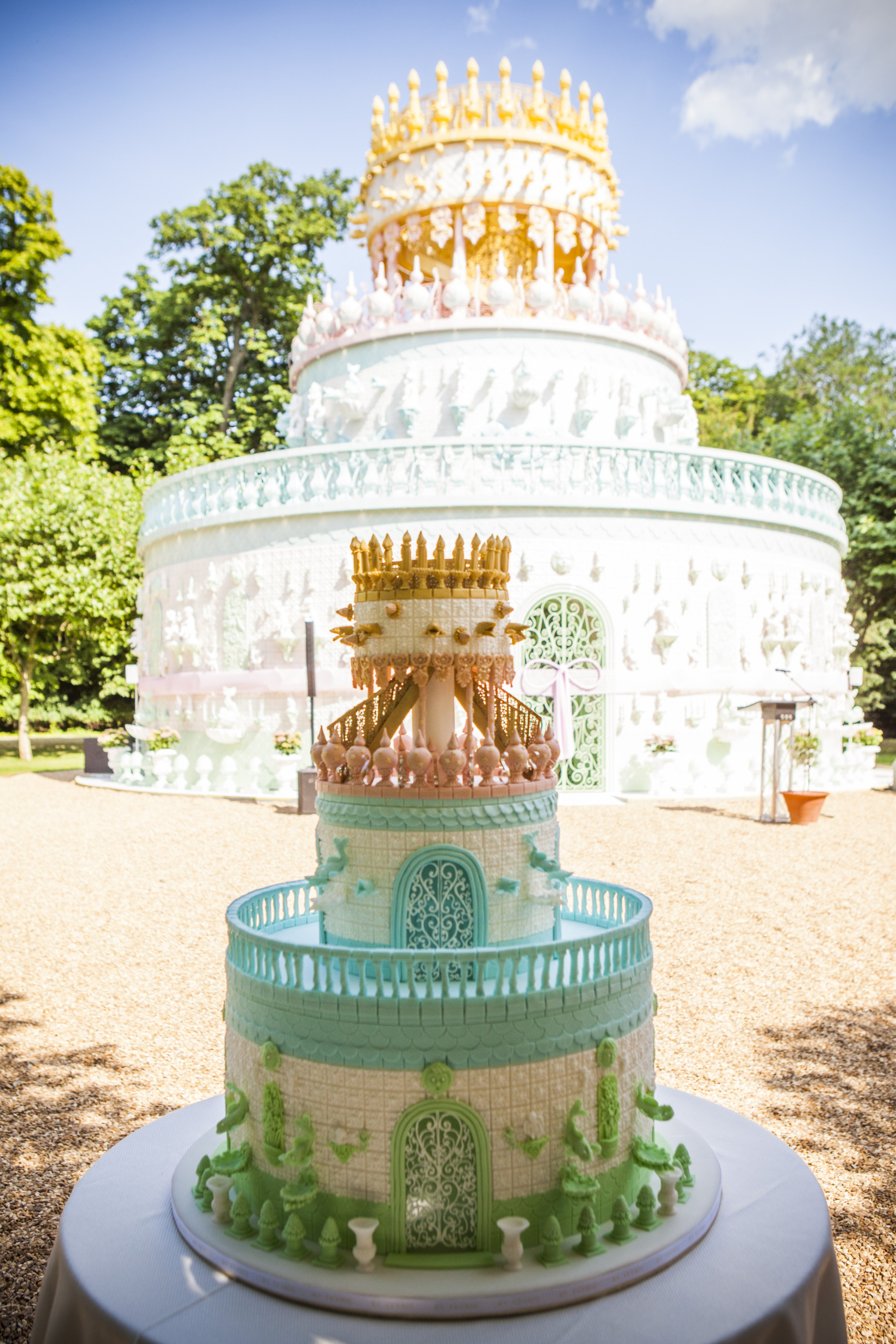 The Wedding Cake By Yevnig sits in front of the Wedding Cake Folly, by Joana Vasconcelos at Waddesdon Manor