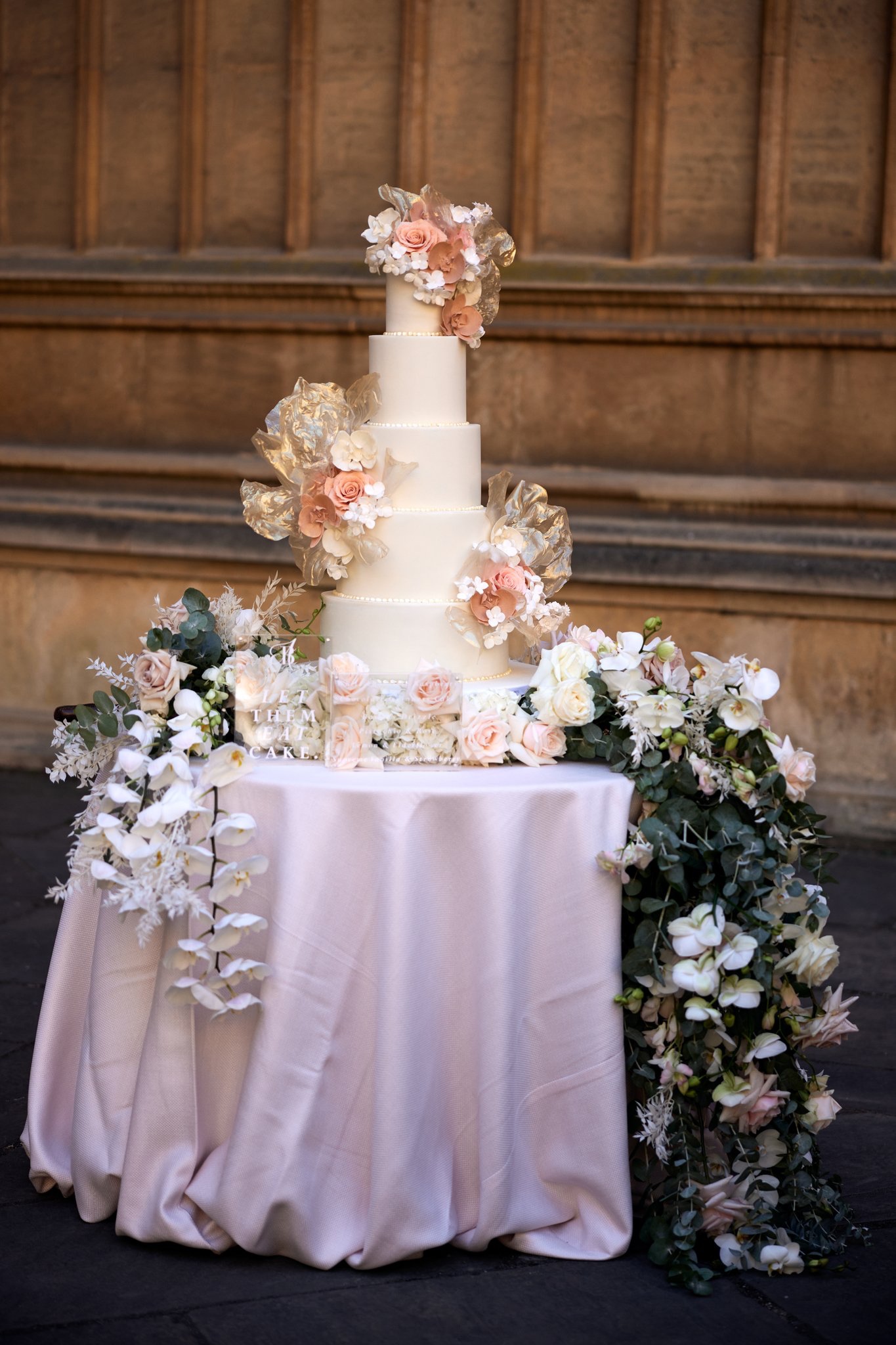 By Yevnig 5 tier contemporary ivory rice paper bohemian wedding cake at a Maple Rose designed wedding, Bodleian Library, Oxfordshire captured by Zaki Charles Photography