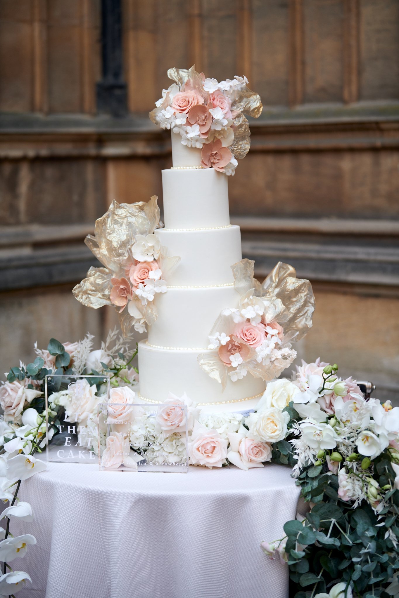 By Yevnig 5 tier contemporary ivory rice paper bohemian wedding cake at a Maple Rose designed wedding, Bodleian Library, Oxfordshire captured by Zaki Charles Photography