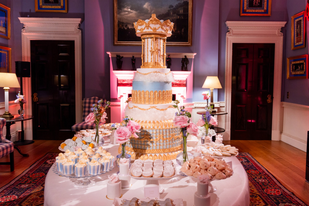 The Carousel luxury occasion cake and dessert table by Yevnig in the Music Room at Spencer House.