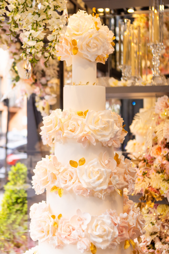 Luxury floral wedding cake By Yevnig in the window of Neill Strain Floral Couture, Mayfair.